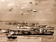 British LCT's line the Normandy shore, each with a barrage balloon designed to discourage enemy air attack. (From «Coast Guard at Normandy» by Scott T. Price.)